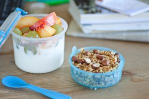 Granola with yoghurt and fruits to go.