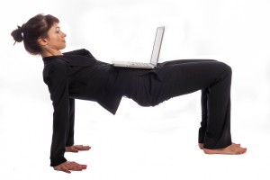 Woman doing Yoga at Work.